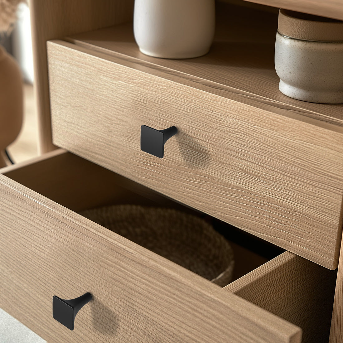 Black cabinet pull installed on cabinets or drawers