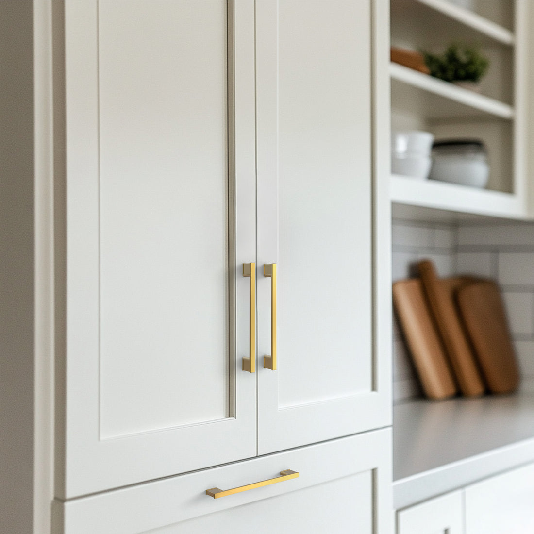 Light brass cabinet pull installed on cabinets or drawers