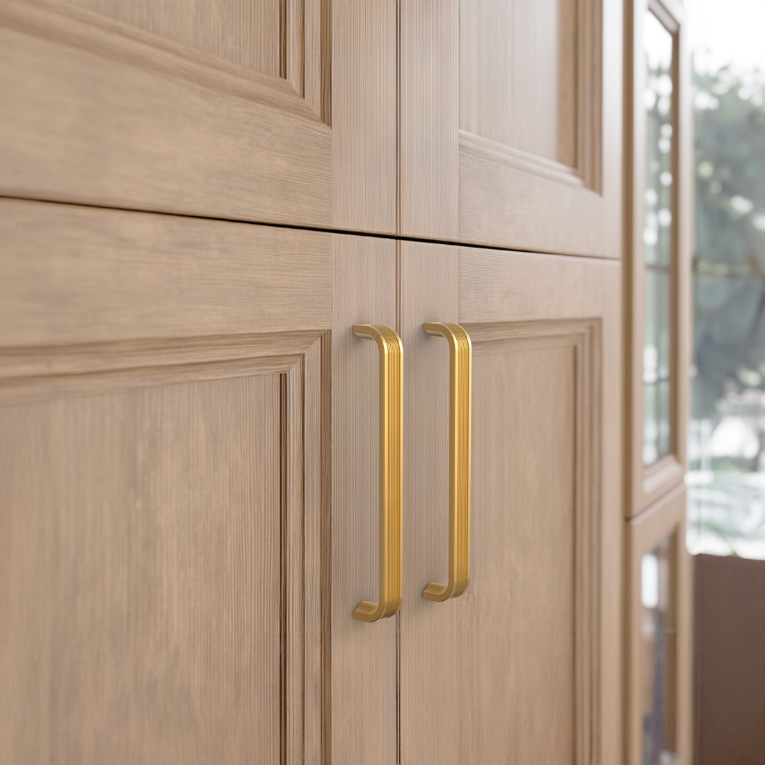 Light brass cabinet pull installed on cabinets or drawers