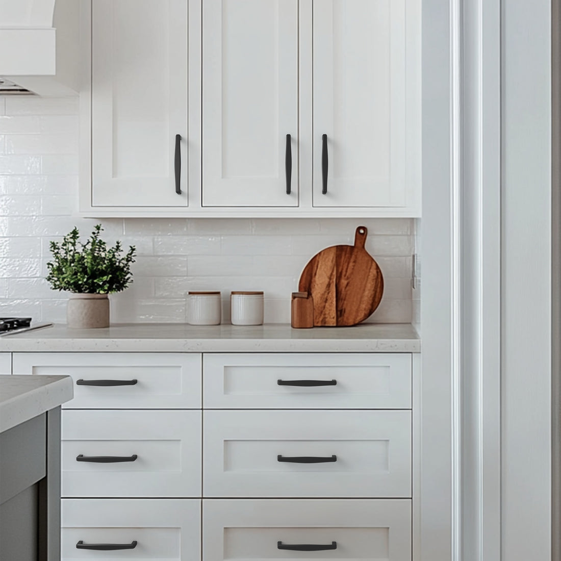 Black cabinet pull installed on cabinets or drawers