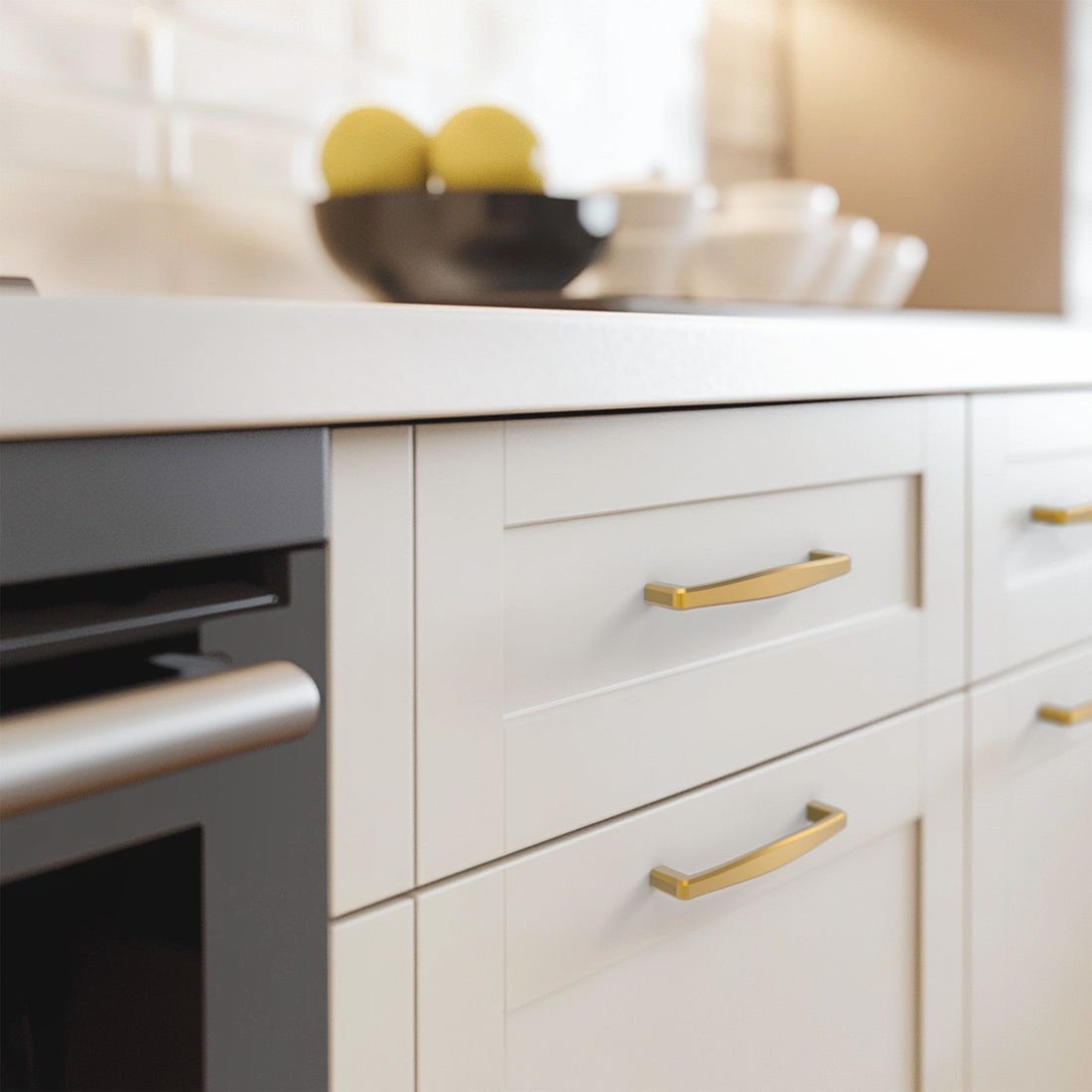 Light brass cabinet pull installed on cabinets or drawers
